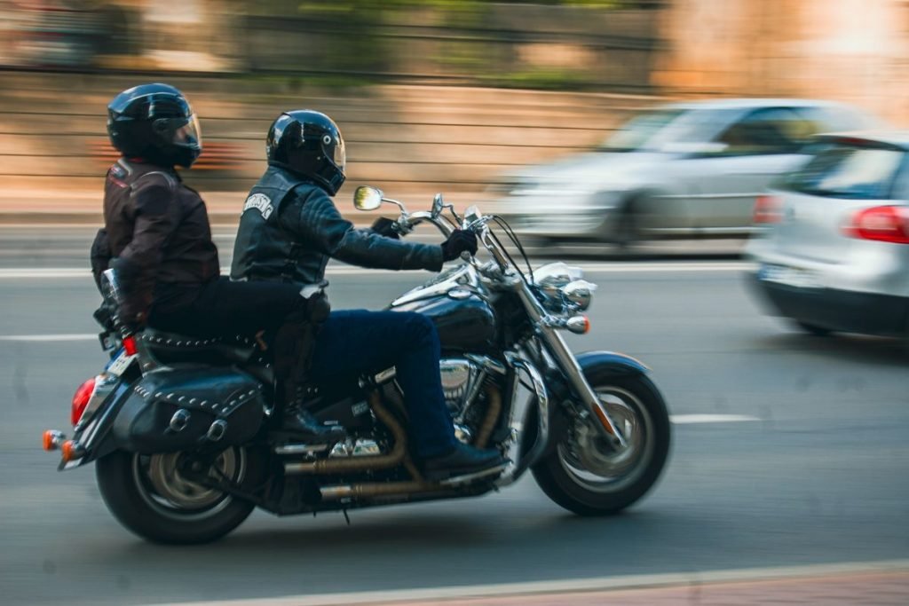 harley rider and passenger - motorcycle pillion passenger