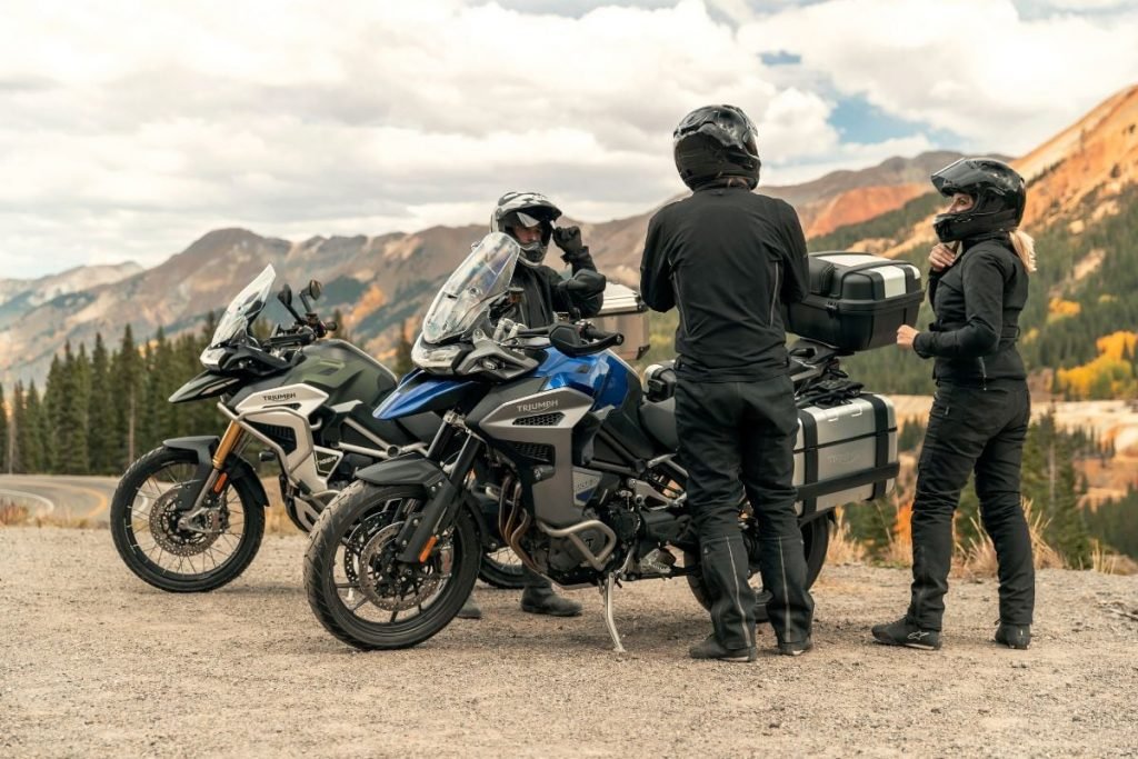 riders and passenger on triumph's