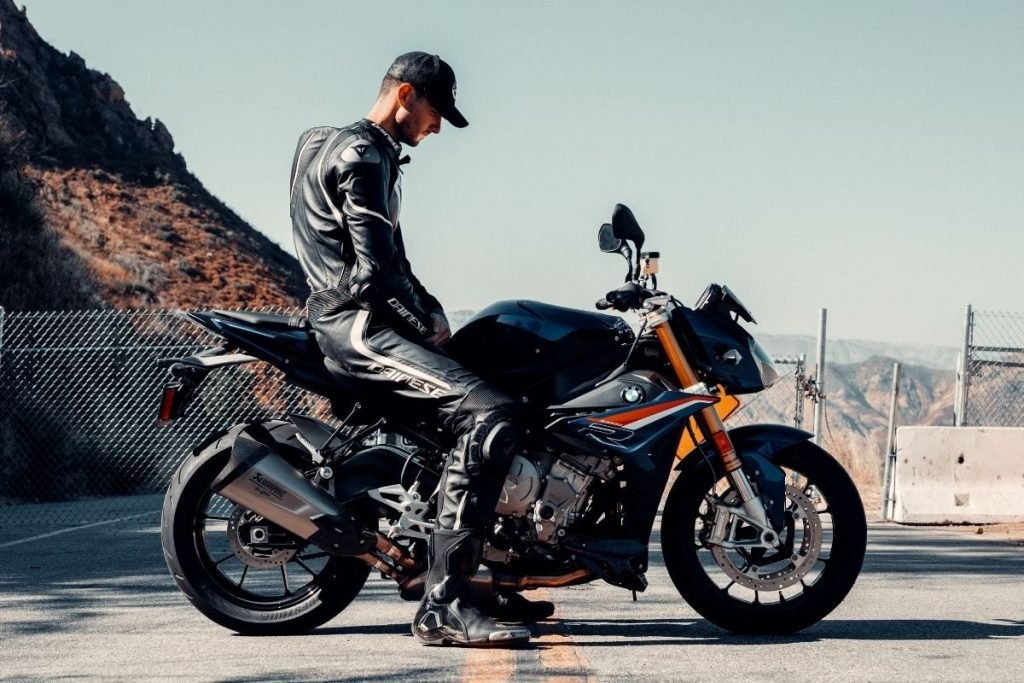 rider wearing one-piece leathers on BMW bike