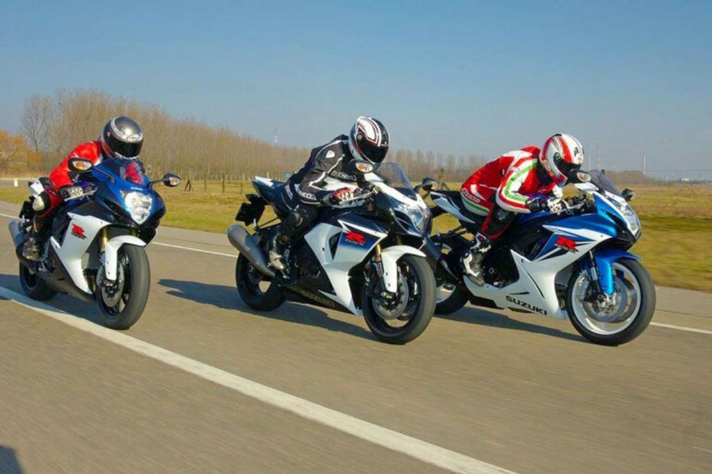 3 sports bikes racing - group motorcycle riding