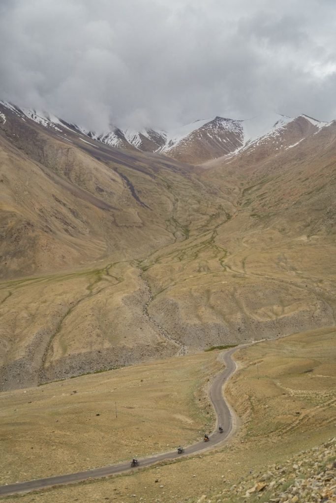 riders on mountain road - motorcycle touring holiday
