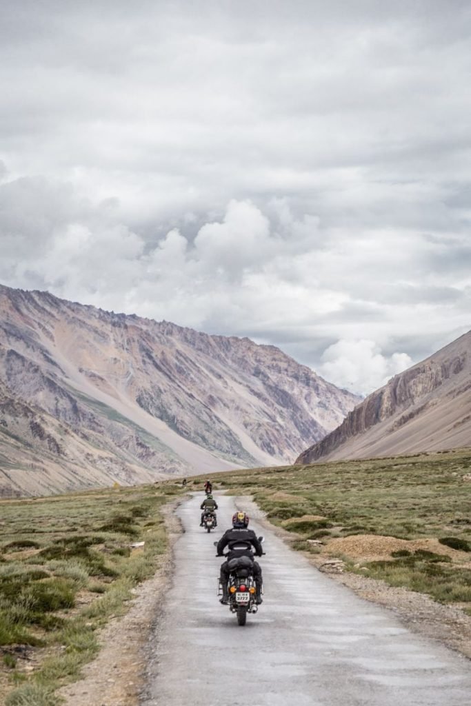 group of riders in mountains - motorcycle touring holiday
