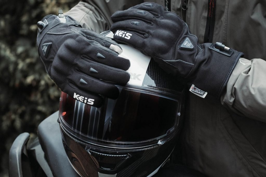 rider holding helmet