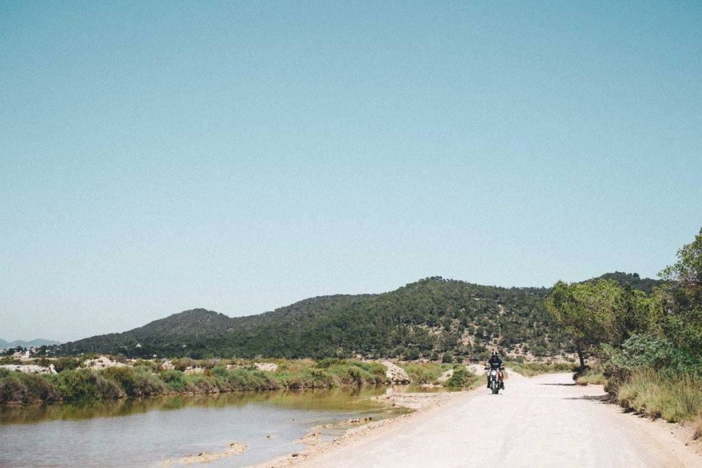 plan long-distance motorcycle - rider on country roads