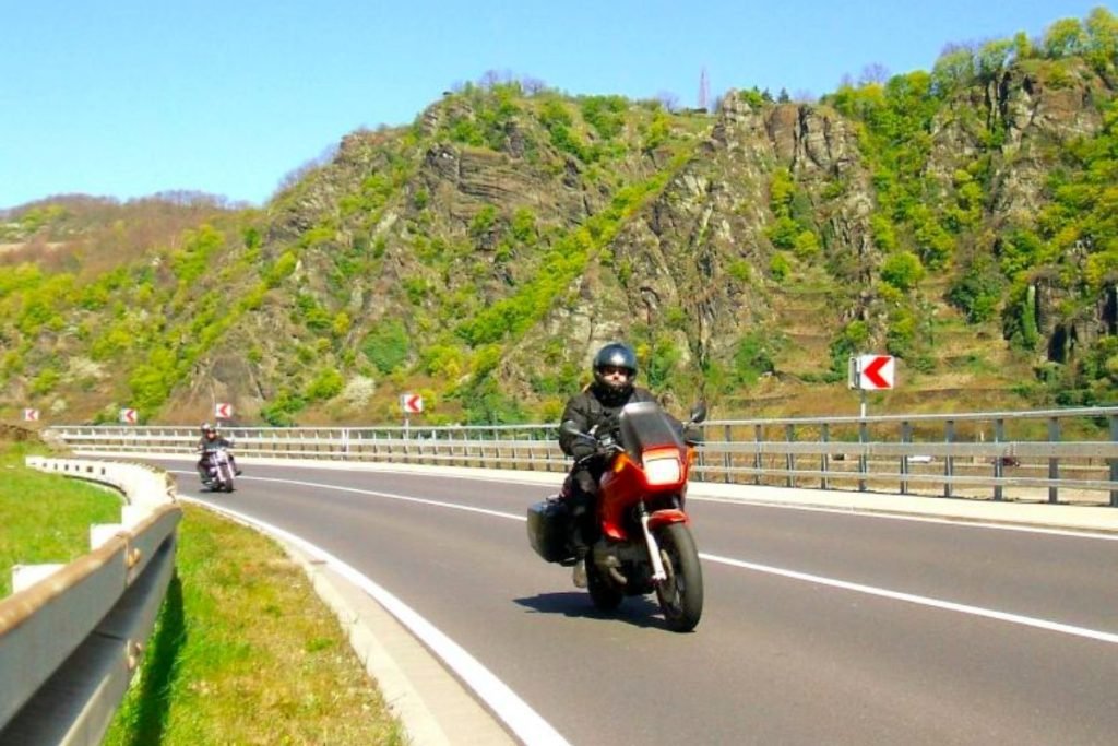 two riders on mountain road