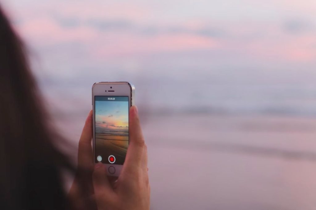 person making video with iphone