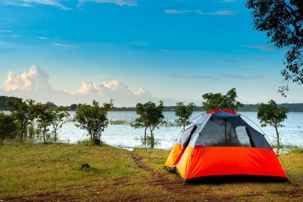 camping on a motorcycle by lake