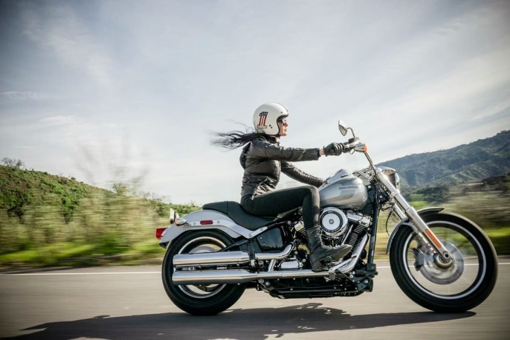 staying awake motorcycle rides - rider on harley davidson with helmet open